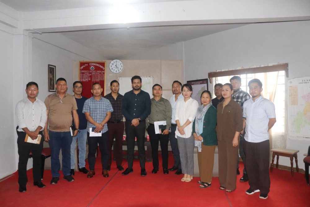 DWSM Chairman Dharam Raj, along with other officials during the review meeting held at the chamber of the Deputy Commissioner in Zunheboto on July 28. (Morung Photo)